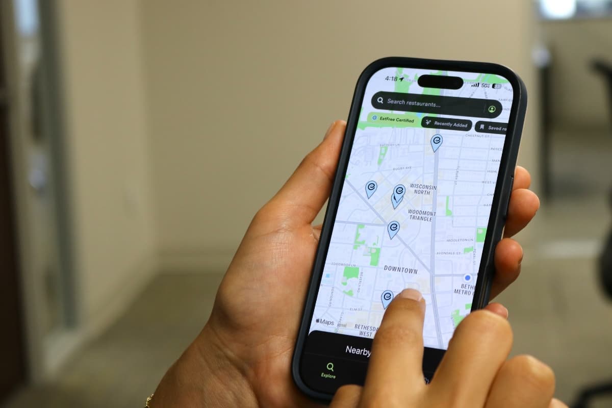 The EatFree map open on a phone in hand